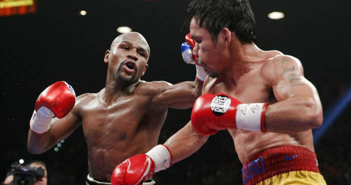 El campeón estadounidense Floyd Mayweather Jr. (i) venció anoche por decisión unánime al filipino Manny Pacquiao (d) en la pelea de unificación del título del peso welter, versión Consejo Mundial de Boxeo (CMB), Asociación Mundial (AMB) y Organización Mundial (OMB), pactada a 12 asaltos, y se mantuvo invicto. Foto: EFE