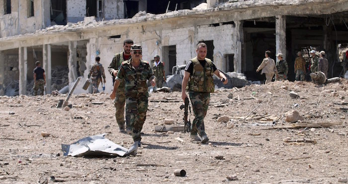 Fotografía facilitada por la Agencia de noticias siria SANA que muestra a un grupo de soldados sirios en una Academina militar en Alepo, Siria. Foto: EFE