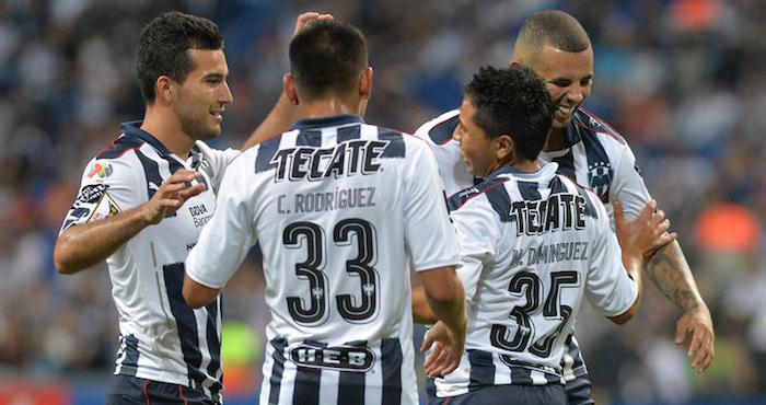 Jugadores de Rayados de Monterrey festejan una anotación ante Don Bosco de Haití durante un partido de la fase de grupos de la Liga de Campeones de Concacaf, en el estadio BBVA de Monterrey. Foto: EFE