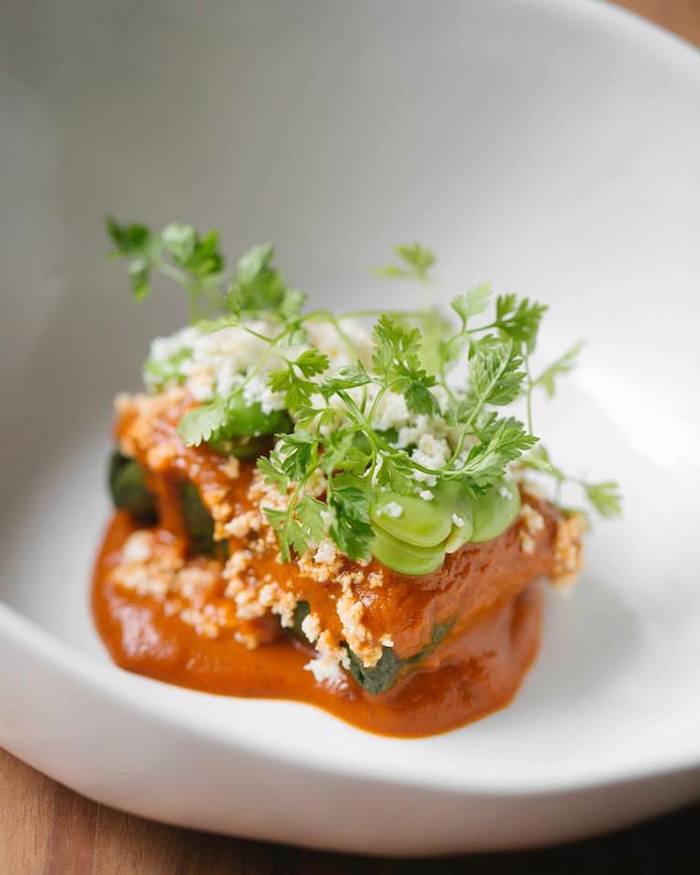 Tamal de amarillito, haba y acelga. Foto: Facebook (pujolrestaurante)