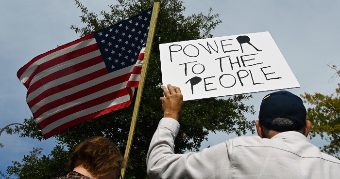 Protesters participate in a protest "No Kings" in Washington, DC, United States.